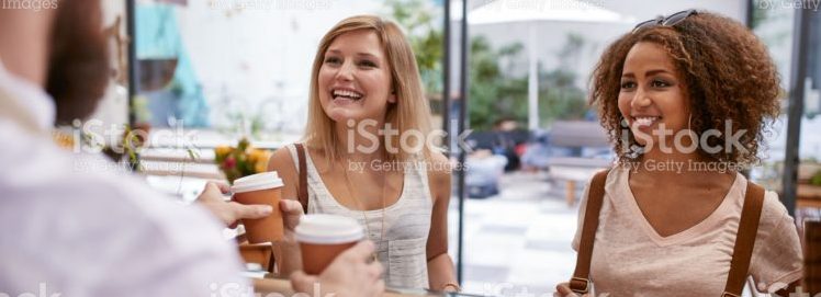women-friends-receiving-their-hot-drinks-at-cafe-picture-id513944572